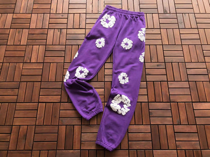 Denim Tears Le pantalon de jogging Cotton Wreath