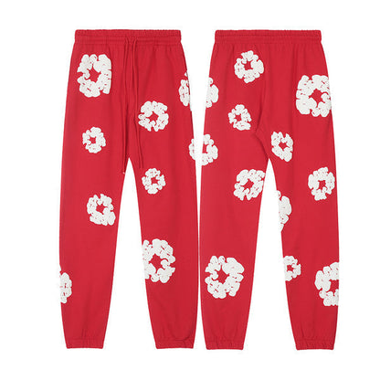 Denim Tears Le pantalon de jogging Cotton Wreath