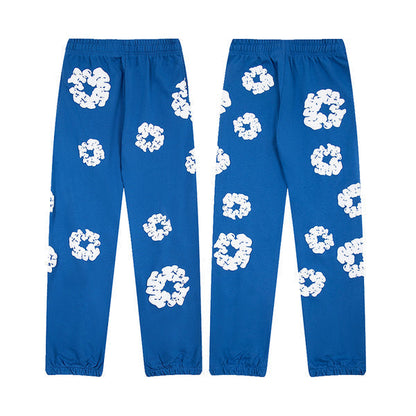 Denim Tears Le pantalon de jogging Cotton Wreath