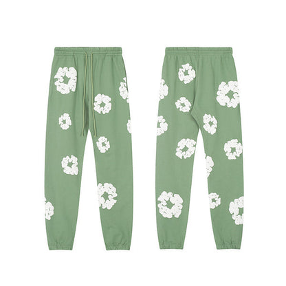Denim Tears Le pantalon de jogging Cotton Wreath