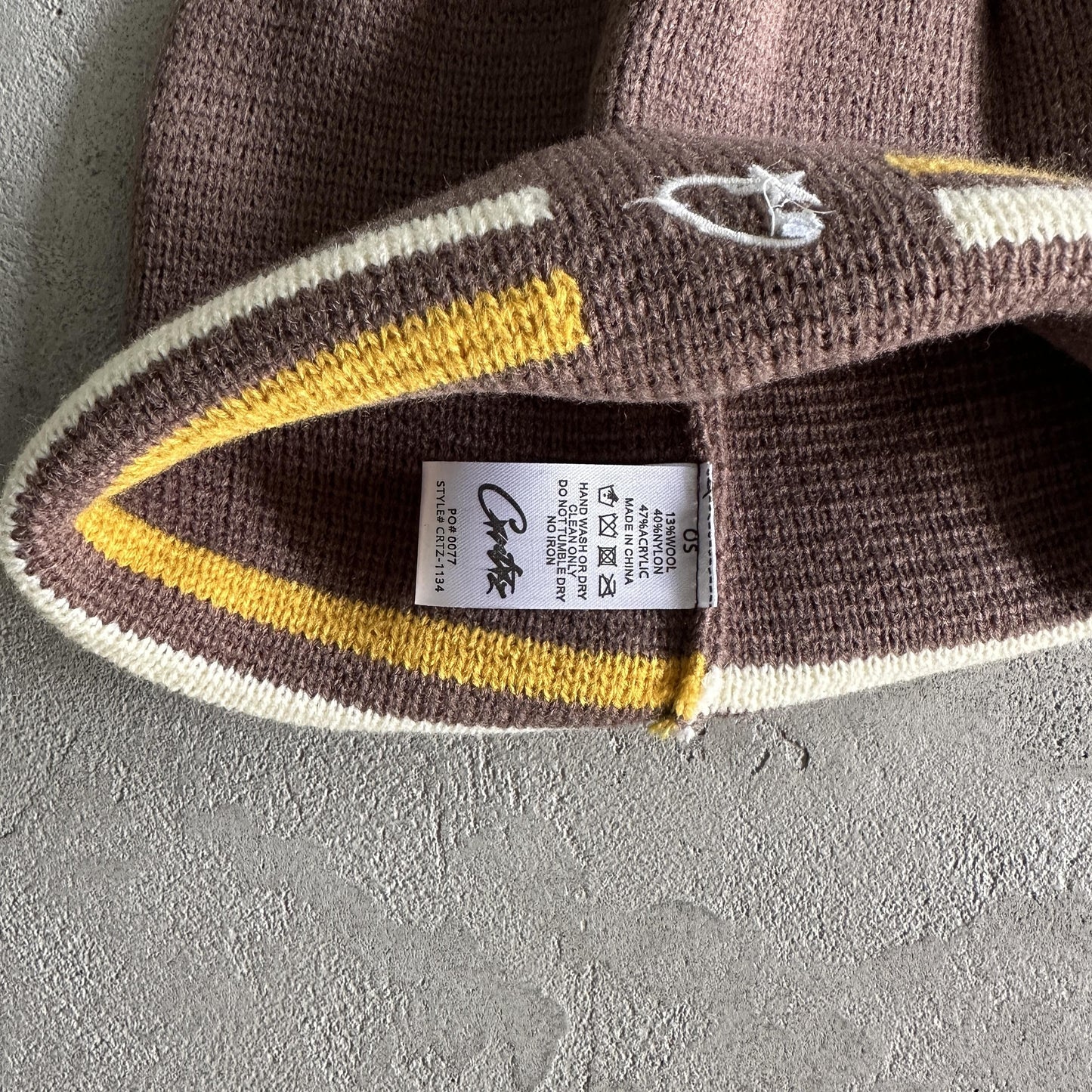 Bonnet rayé en maille Corteiz - Marron